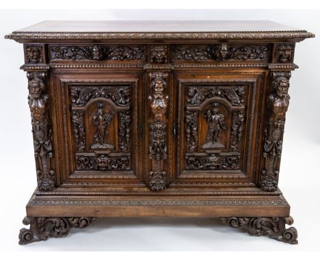 A RENAISSANCE REVIVAL WOODEN COMMODE, EARLY 20TH CENTURY rectangular, on four feet, of which two are spreading, carved throug