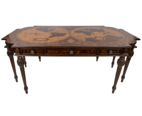 A MAITLAND-SMITH TABLE with pair of world maps separated by a fleur-de-lys crest, surrounded by scrolling acanthus leaf motif