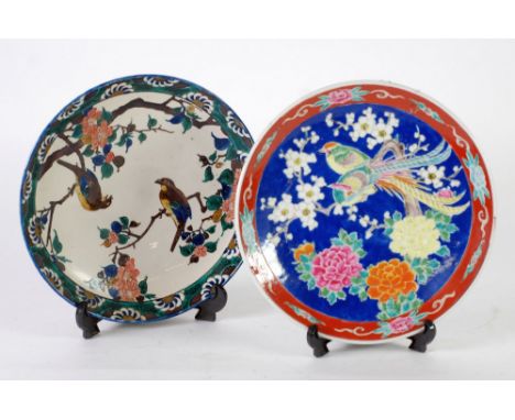 MODERN ORIENTAL POTTERY CIRCULAR PLAQUE, decorated with two birds in branches, 9 ó" (24.8cm) diameter AND ANOTHER CIRCULAR PL