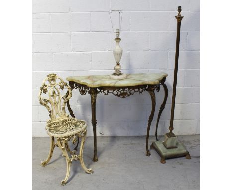 A c1970 onyx top console table, supported on figural cabriole legs with shell and diaper pattern frieze, an onyx base Corinth