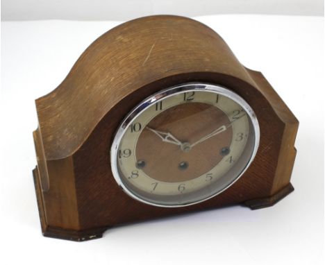 A 1930s Enfield oak-cased mantel clock, chiming and striking on rods, height 23cm.