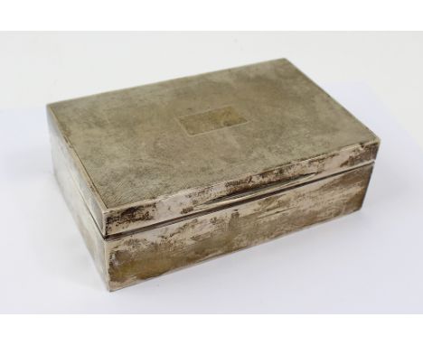 A hallmarked silver engine turned cigarette box with cedar wood lining, Birmingham 1939, width 14.5cm, approx 12ozt.