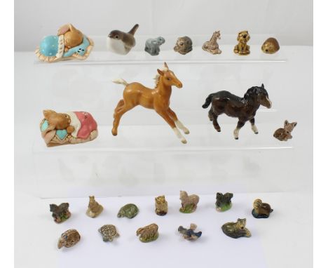 Eighteen Wade Whimsies and other figures, two Pendelfin Bunnykins figures; 'Peeps' and 'Snuggles', a Russian ceramic bird fig