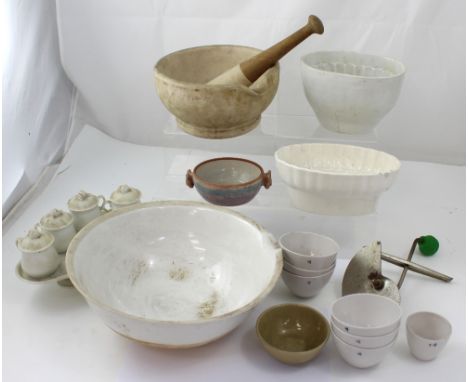 An early 20th century pestle and mortar, two blanc de Chine jelly moulds, one with grape pattern, one with hare, a set of Ame