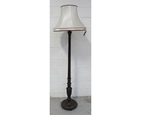 An early 20th century stained beech standard lamp with reeded column to lappet carved platform base, height 152.5cm.