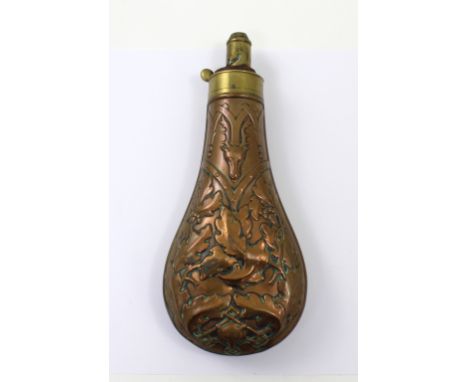 A 19th century copper powder flask by JW Hawksley with moulded stag heads, oak leaves and acorns above a fox mask to the base