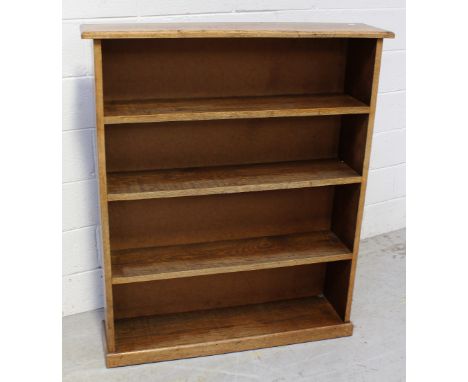 A mid 20th century oak three shelf bookcase on plinth support, 99 x 117cm.