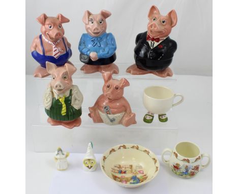 A set of five Wade money banks, a Carlton ware cup, a Bunnykins cup, bowl, and two Royal Worcester candle snuffers (10).