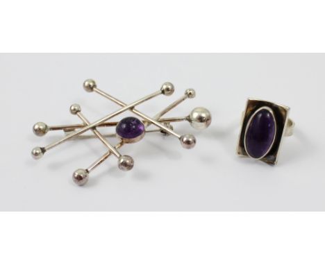 Niels Erik From (Danish 1908-1982); a silver rod and ball cabochon amethyst set brooch, made of five criss-crossing rods of s