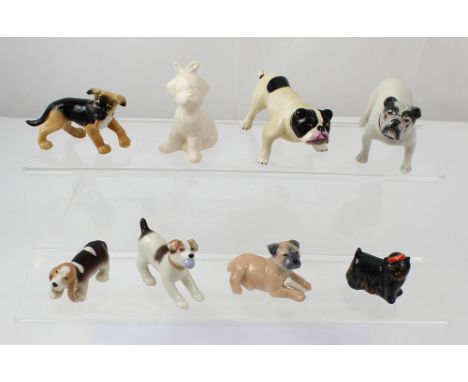 A collection of ceramic dog figures to include three boxed Copenhagen 'Puppy Collection' puppies, a Heutshenreuther Alsatian 