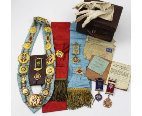 A collection of Royal Antediluvian Order Of Buffaloes (ROAB) regalia to include a red and a blue Baron Lodge sash, a blue mat