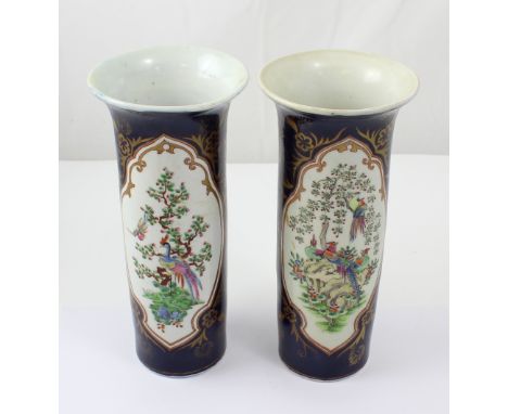 A pair of 20th century reproduction cylindrical vases with flared neck cobalt blue and gilt heightened body with large vignet
