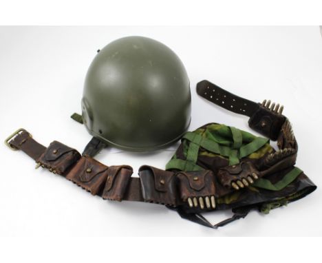 A GS Mk.IV combat helmet, and an ammunition belt with replica ammunition (2).