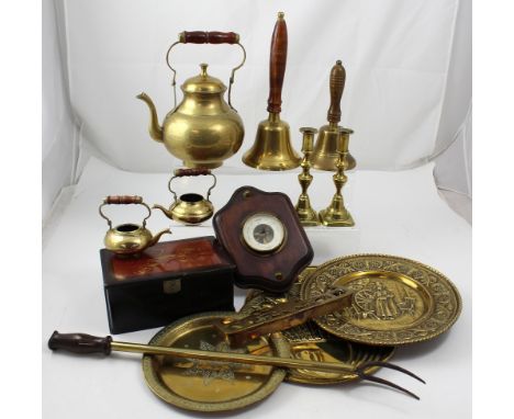 A collection of brass to include hand bells, brass candlesticks, an Eastern brass teapot, an aneroid barometer and a Japanese