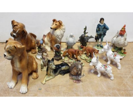 A collection of bisque and glazed animalier groups to include a crowing cockerel, collie dog, two bisque foxes, a bisque fant