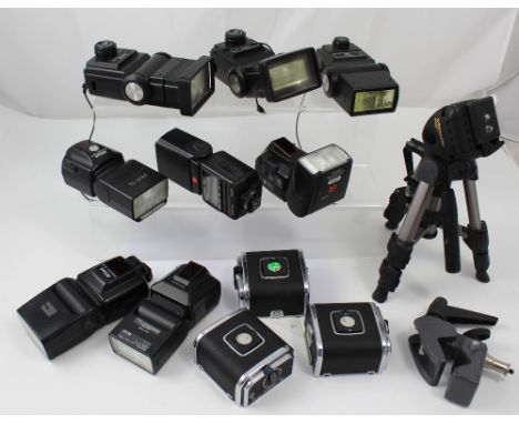 A large collection of 35mm camera accessories to include a large selection of flash guns, light meters, battery packs, film c