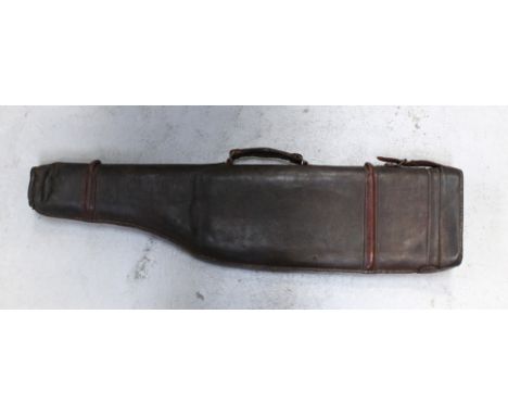 A vintage leather leg of mutton shotgun case with leather strap and handle, length 75cm.