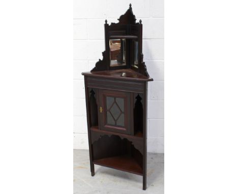 A late Victorian red walnut floor standing corner cabinet with mirrored top and single glazed cupboard door to base, and lowe