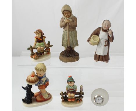 Three Hummel figurines, boy and a girl sitting on a fence, and a young boy carrying a birthday cake, a Royal Doulton cut glas