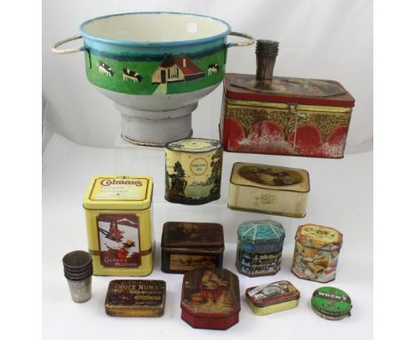 A small collection of vintage tins, tin-plated vintage baking tins and a large painted metal funnel.