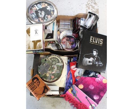 A quantity of Elvis Presley related ephemera to include a retro alarm clock, a ceramic stein with guitar lift up lid, various