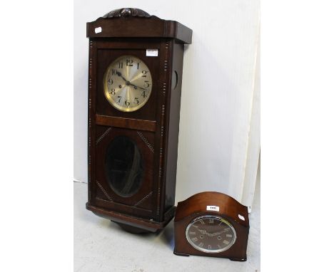A c1940s eight day wall clock, and a c1950s Smith Enfield mahogany cased eight day mantel clock the wooden dial set with Roma