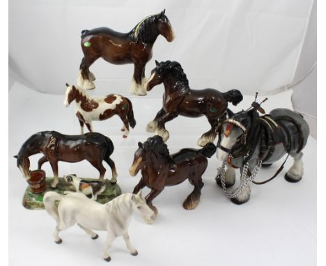 Seven Beswick and other horses to include two Beswick prancing Clydesdales, a white stallion, a standing Clydesdale, a skewba