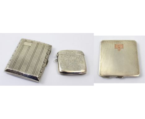 A George V hallmarked silver engine turned cigarette case, Sheffield 1925-26, an Edward VII hallmarked silver large vesta  ca