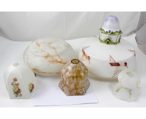 A collection vintage mottled and latte glass lamp shades to include two large art Deco style pendant examples, and four small