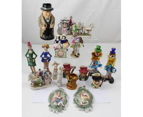 A collection of ceramic and glass figure, character, and toby jugs to include a Royal Doulton Winston Churchill character jug