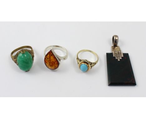 A ladies' silver dress ring set with amber stone, a yellow metal dress ring with turquoise coloured stone, 1920s dress ring w