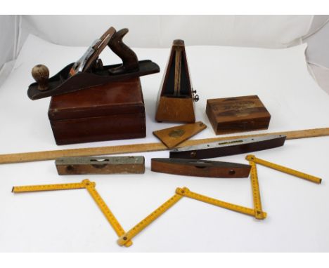A collectors lot to include a vintage Stanley no.5 plane, a Maelzel metronome, various levels, olive wood box etc.