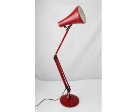 A retro red Anglepoise lamp.