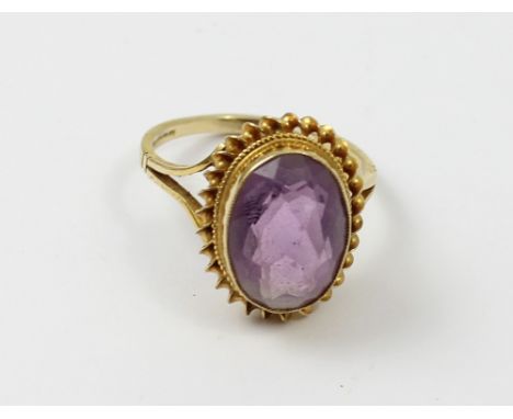 A ladies 9ct gold dress ring with oval amethyst, size Q, approx 4.3g.