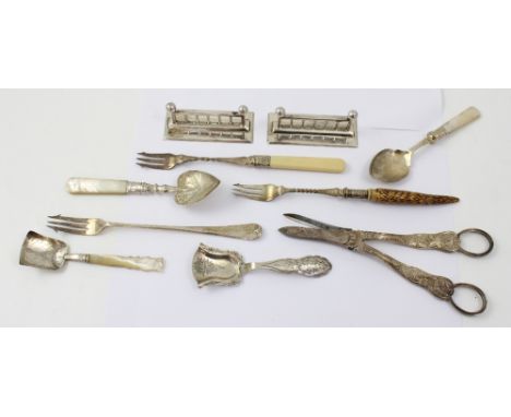 A Continental silver caddy spoon, an Edwardian silver spade shaped sugar spoon with abalone handle, a Victorian silver spade 