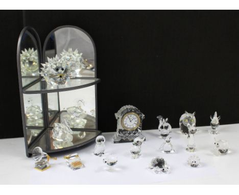 A selection of cased Swarovski animals to include porcupine, squirrel, seated cat, goldfish, duckling, swan, owl, snail, larg