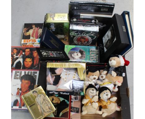 A quantity of ephemera relating to Elvis Presley, 'The King', to include unopened box sets, jigsaws, Elvis trivia game, check