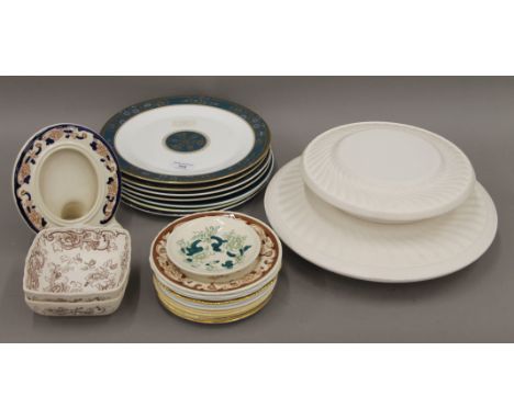 A quantity of Royal Doulton and Royal Worcester and Aynsley plates at different stages of the decoration process and two moul