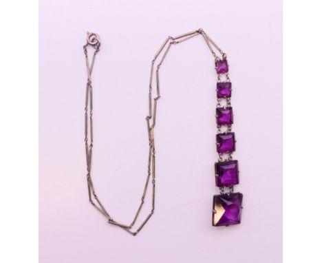 An Art Deco necklace.  40 cm long, pendant 7 cm high.