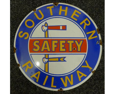 A railway enamel sign. 35 cm diameter.