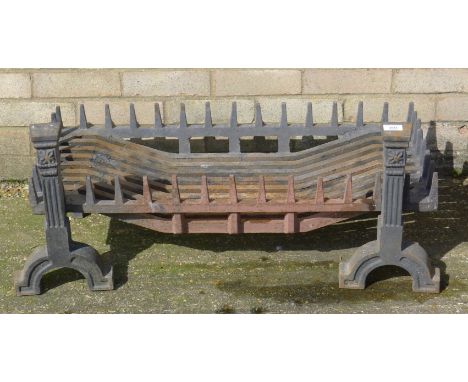 A cast iron fire grate. 105 cm wide.