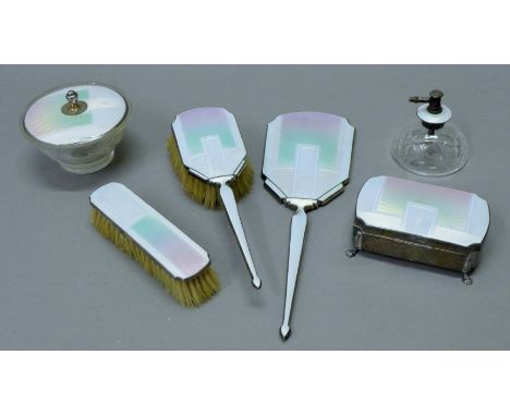 An Art Deco cased enamel decorated silver dressing table set, cased. The case 40 cm wide.