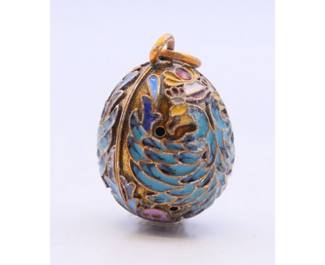 A silver enamel pendant in the form of an egg bearing Russian marks.  2.5 cm high. 