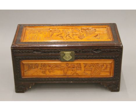An Eastern carved trunk. 69 cm wide.