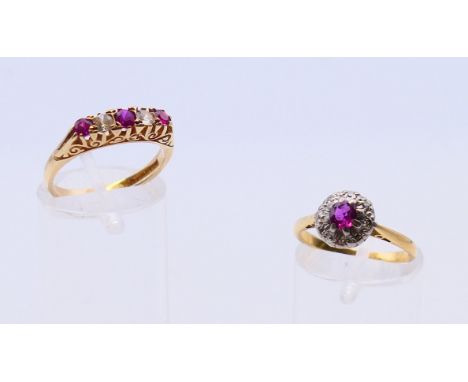 An 18 ct ruby and diamond cluster ring, ring size L, and a 9 ct gold five stone ring set with three rubies and two white ston