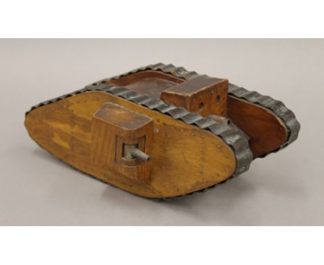 A Trench Art World War I tank. 16 cm wide.