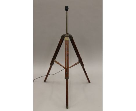 A tripod form lamp. 130 cm high.