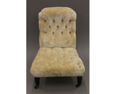 A Victorian button upholstered nursing chair. 59 cm wide.