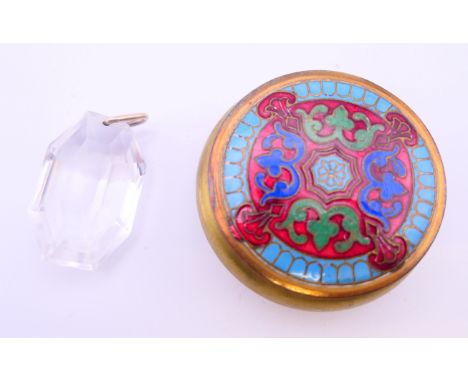A crystal pendant drop in an enamel box.  Pendant drop 4 cm high.