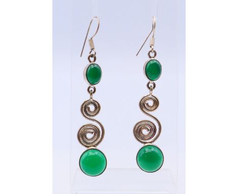 A pair of jade and silver earrings.  6 cm high.